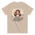Beige t-shirt with cartoon character and humorous text on a white background