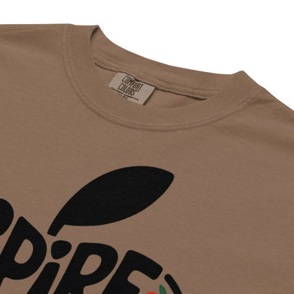 Brown t-shirt with black leaf graphic and brand label on a white background