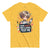 Yellow t-shirt with a graphic of a person holding a syringe and text 'I give shots for a living. Test me.