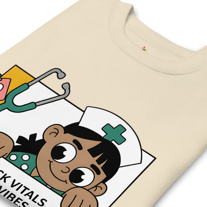 Beige t-shirt with a cartoon character and medical-themed design on a white background