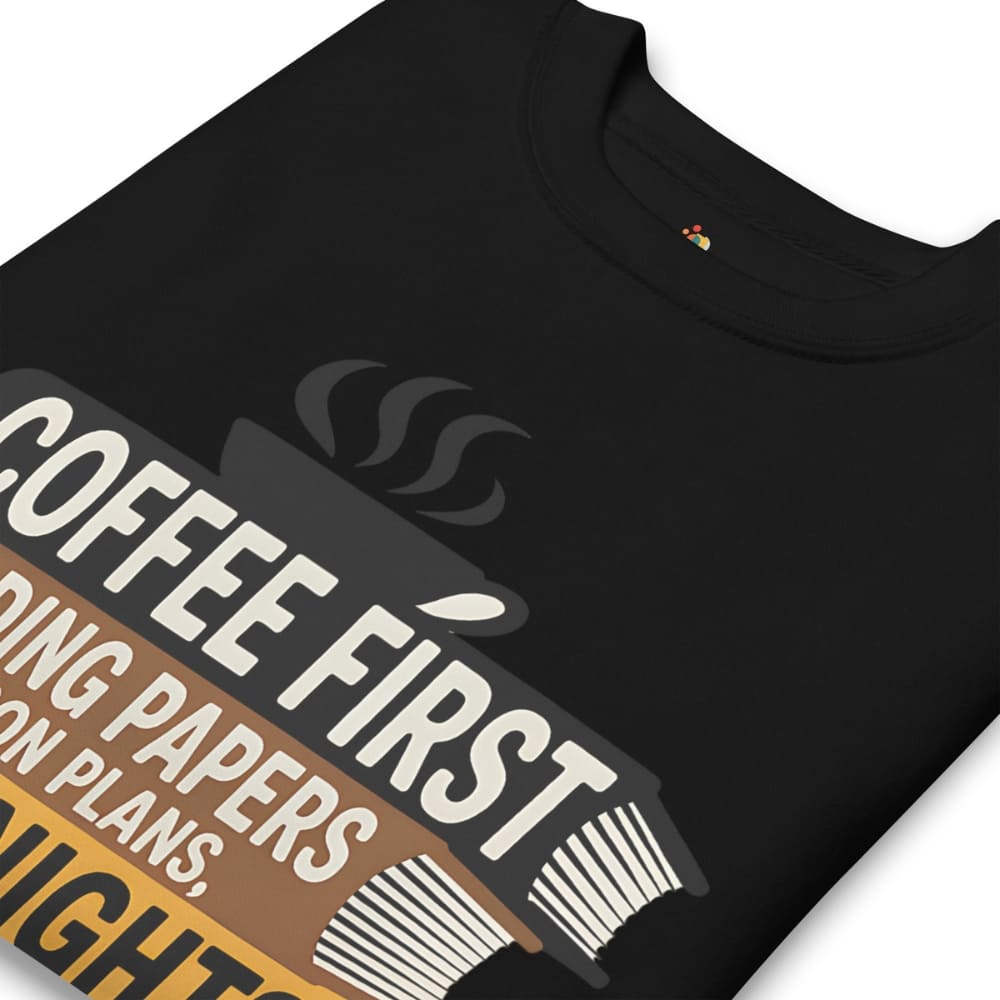 Black t-shirt with 'Coffee First' graphic design on a white background