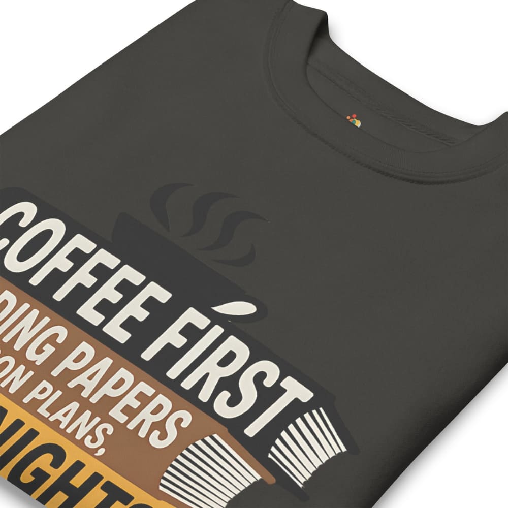 Black t-shirt with 'Coffee First' text design on a white background