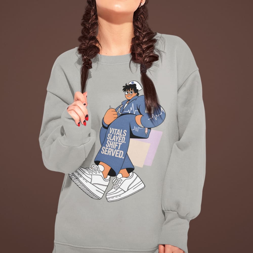 Person wearing a gray sweatshirt with a graphic design on a brown background