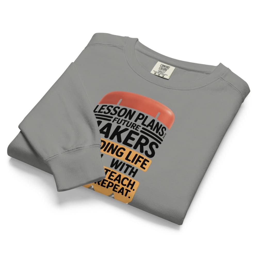 Folded gray sweatshirt with text design on a white background