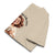 Beige pants with a printed design on a white background