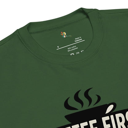 Green t-shirt with a coffee design and 'Made in Pakistan' label on the collar.