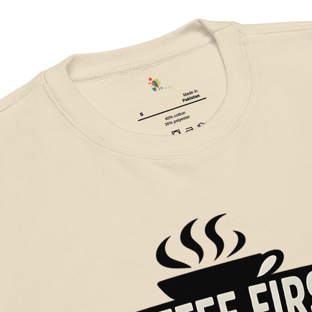 Beige t-shirt with black coffee cup graphic and text on a white background