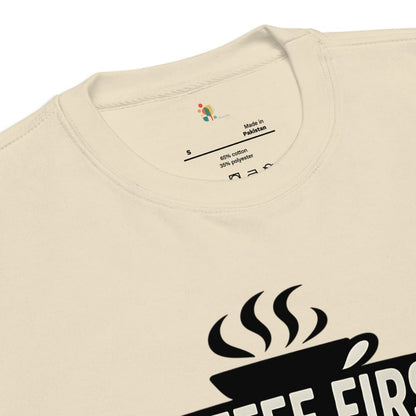 Beige t-shirt with black coffee cup graphic and text on a white background