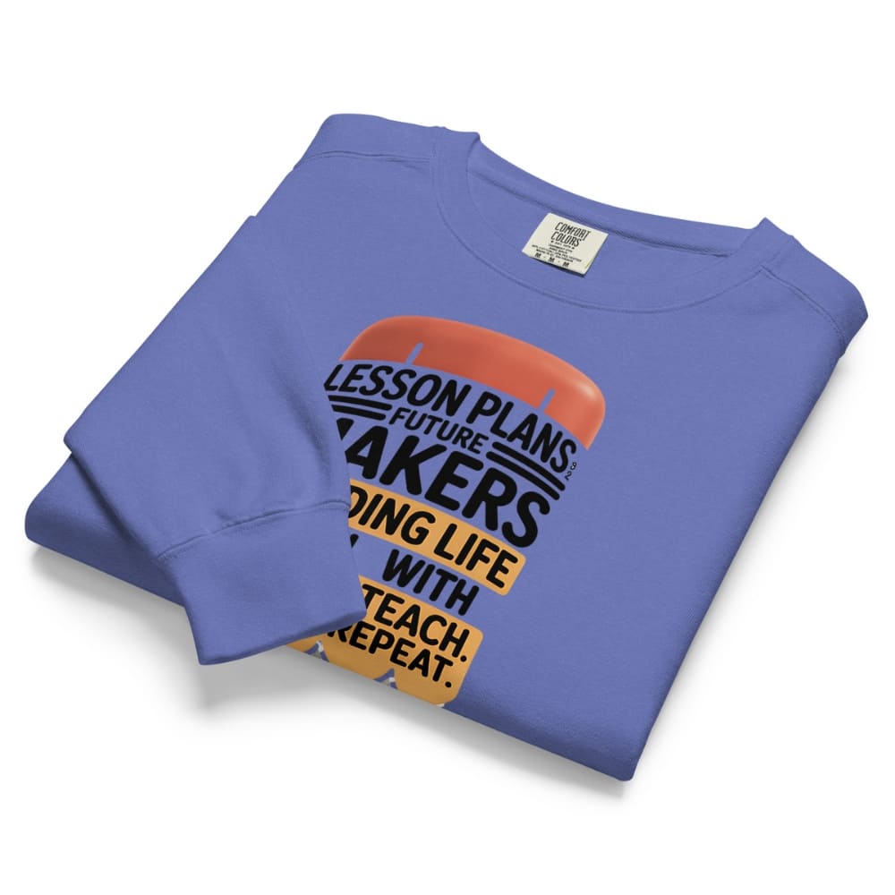 Folded blue sweatshirt with text design on a white background