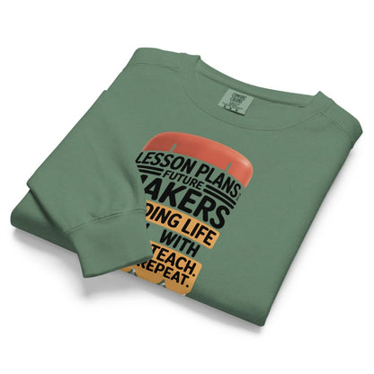 Folded green sweatshirt with text design on a white background