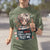 Person wearing a green t-shirt with a graphic design and text.