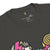 Black t-shirt with colorful graphics and text on a white background