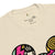 Beige t-shirt with colorful graphic design on a white background