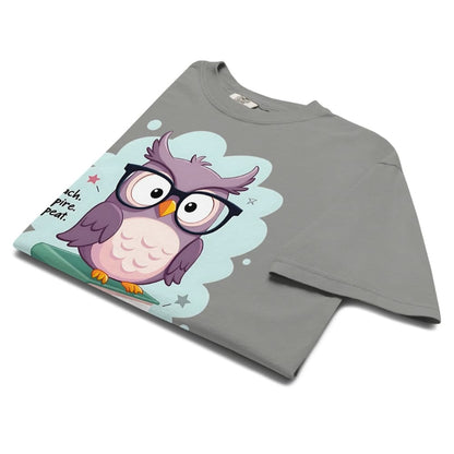 Cute purple owl with glasses sitting on stacked books, with quote "Teach. Inspire. Repeat." – printed on a teacher t-shirt