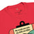 Red t-shirt with a graphic design and text on a white background
