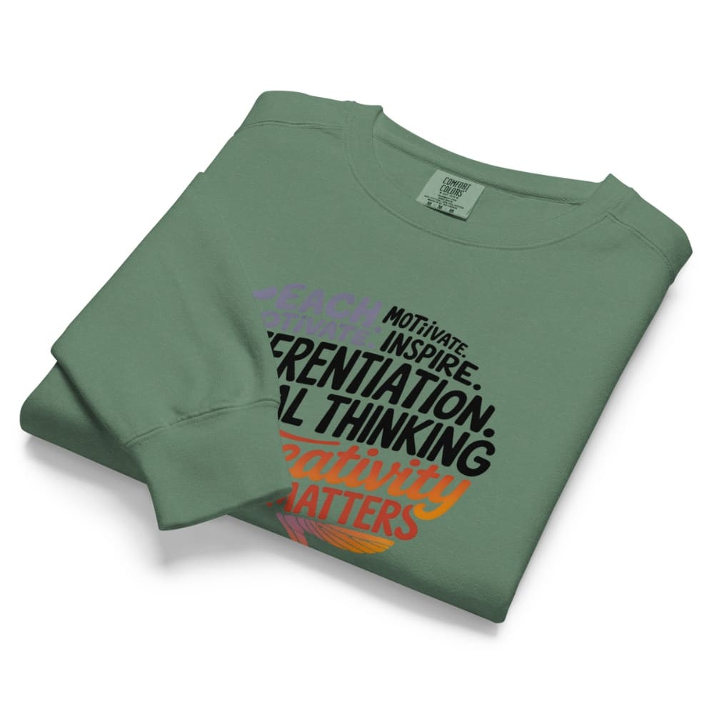 Folded green sweatshirt with text on a white background