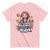 Pink t-shirt with cartoon character and text on a white background