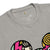 Gray t-shirt with colorful graphics and brand logo on a white background