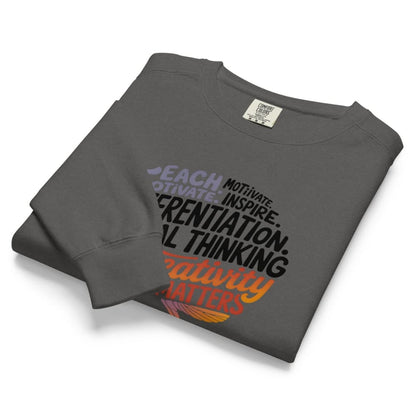 Folded gray sweatshirt with motivational text design on a white background