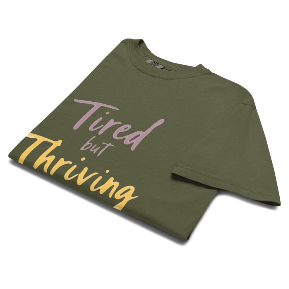 Garment-dyed relaxed fit t-shirt with motivational quote “Tired But Thriving” in modern handwritten script