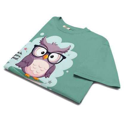 Cute purple owl with glasses sitting on stacked books, with quote "Teach. Inspire. Repeat." – printed on a teacher t-shirt