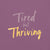 Garment-dyed relaxed fit t-shirt with motivational quote “Tired But Thriving” in modern handwritten script