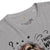 Gray t-shirt with graphic design and text on a white background
