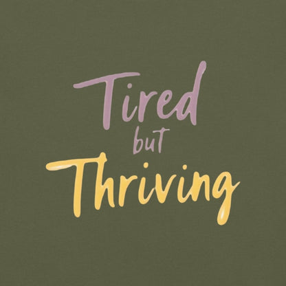 Garment-dyed relaxed fit t-shirt with motivational quote “Tired But Thriving” in modern handwritten script