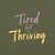 Garment-dyed relaxed fit t-shirt with motivational quote “Tired But Thriving” in modern handwritten script