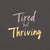 Garment-dyed relaxed fit t-shirt with motivational quote “Tired But Thriving” in modern handwritten script