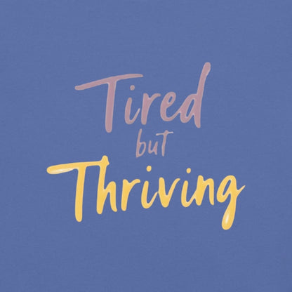 Garment-dyed relaxed fit t-shirt with motivational quote “Tired But Thriving” in modern handwritten script