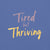 Garment-dyed relaxed fit t-shirt with motivational quote “Tired But Thriving” in modern handwritten script