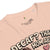 Pink t-shirt with text and graphics on a white background