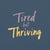 Garment-dyed relaxed fit t-shirt with motivational quote “Tired But Thriving” in modern handwritten script