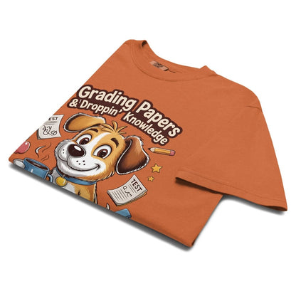 Orange t-shirt with a cartoon dog graphic and text on a white background