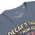 Blue t-shirt with text and graphic design on a white background