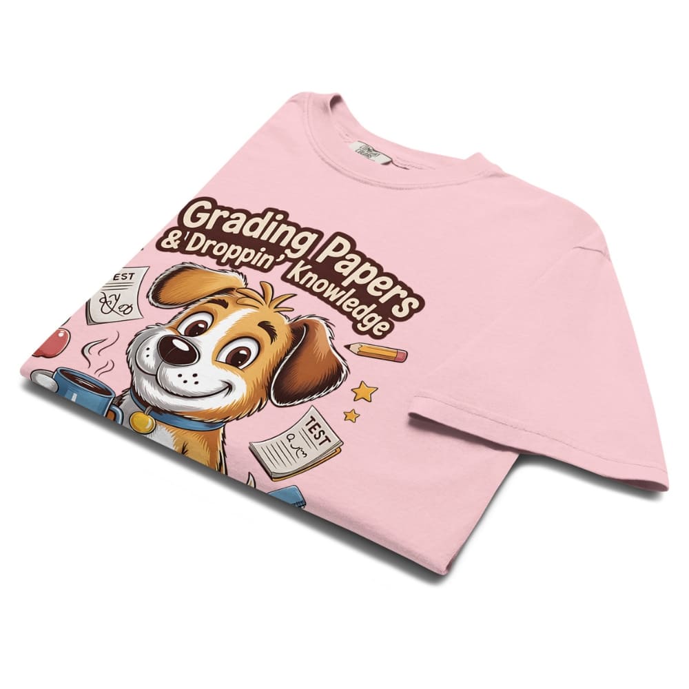 Pink t-shirt with a cartoon dog graphic and text on a white background