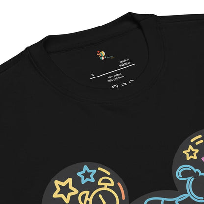 Black t-shirt with colorful graphics and 'Made in Pakistan' label on a white background