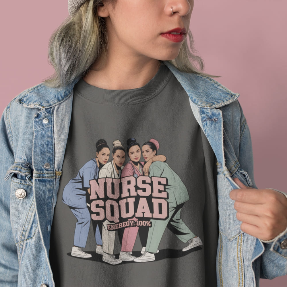 Person wearing a t-shirt with 'Nurse Squad' design and denim jacket on a pink background