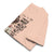 Folded peach  t-shirt with humorous text design on a white background