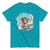 Turquoise t-shirt with an illustration of a character and text 'Keep Talking, I'm Changing Your Attitude' on a white background.