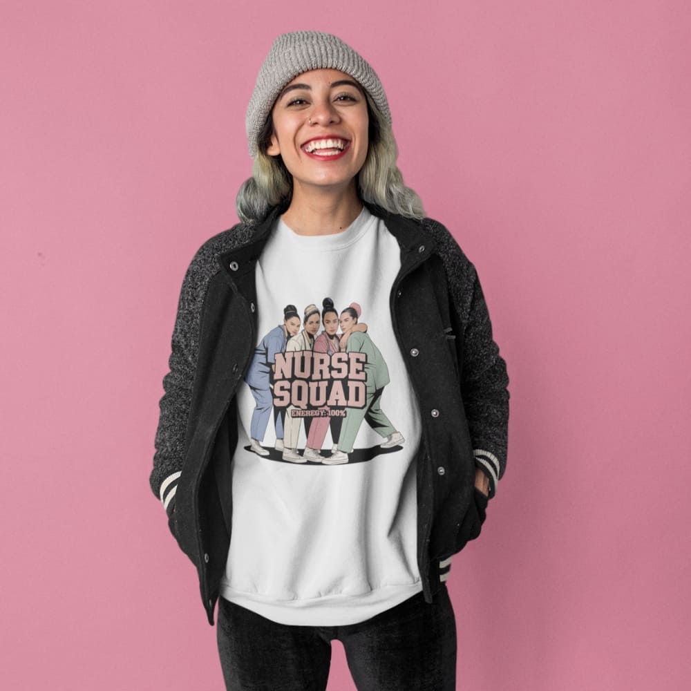Person wearing a white t-shirt with 'Nurse Squad' design on a pink background