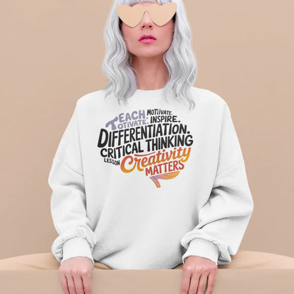 Person wearing a white sweatshirt with motivational text on a beige background