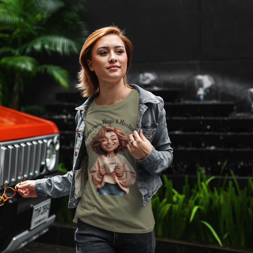 Woman wearing a t-shirt with a graphic design of a girl holding a heart, standing next to a red car.