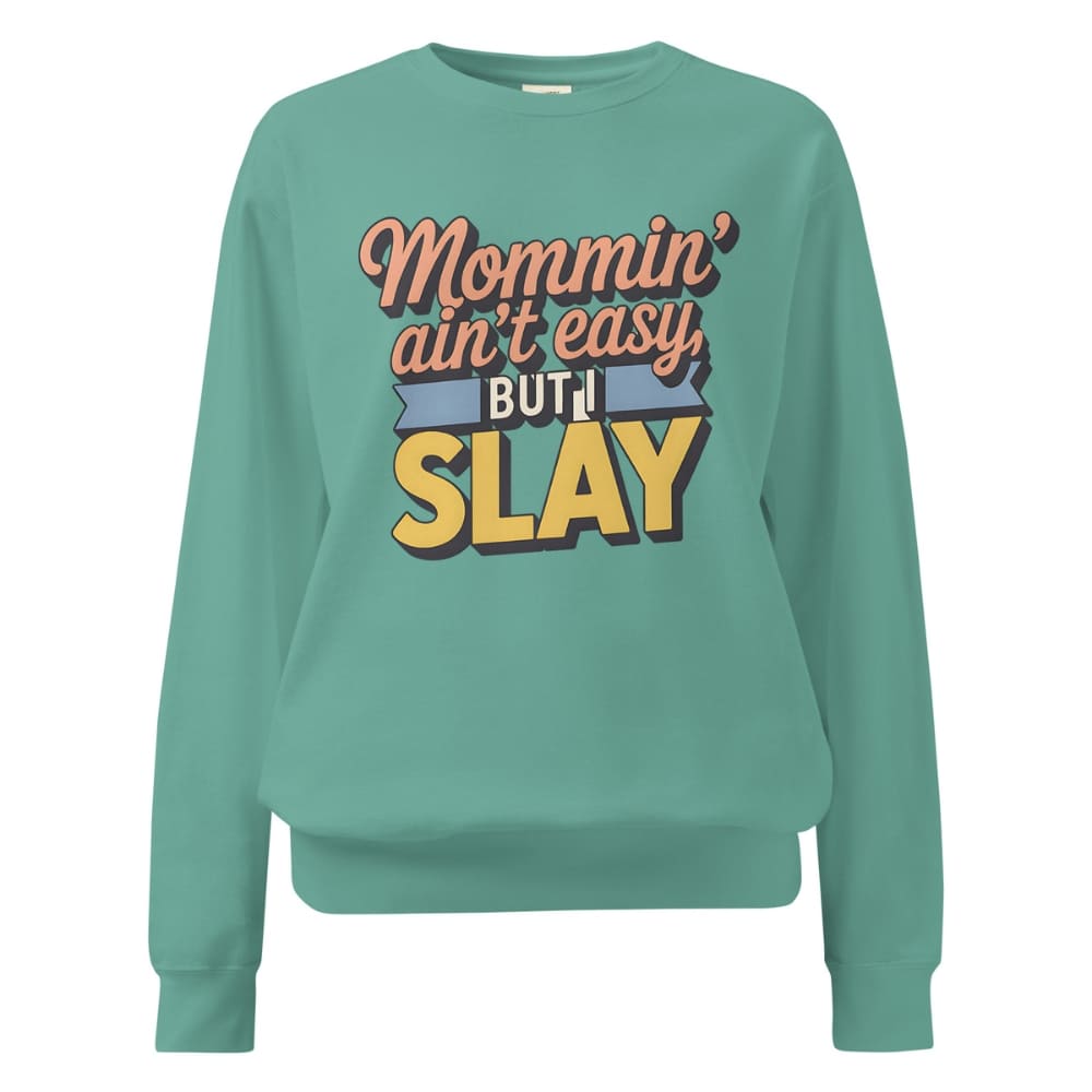 “Mommin' Ain’t Easy But I Slay” retro-style DTG printed design in peach, blue, and yellow on vintage garment-dyed fleece sweatshirt
