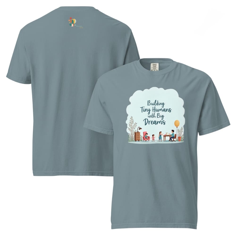 Illustrated t-shirt design with the quote "Building Tiny Humans with Big Dreams" surrounded by a family parenting scene