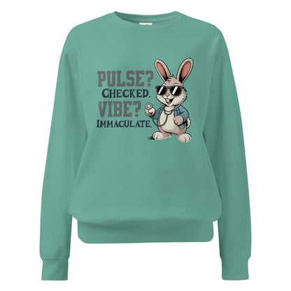 Teal sweatshirt with a cartoon rabbit and text on a white background