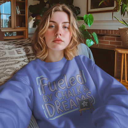 Fueled by Chalk & Dreams printed design on a vintage-style garment-dyed sweatshirt with chalkboard illustration – soft fleece ideal for teachers