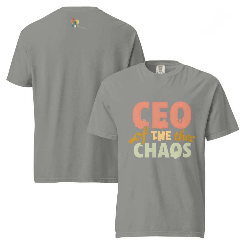 CEO of the Chaos” printed on a heavyweight cotton t-shirt in soft pastel ink, laid flat with a minimal lifestyle background.
