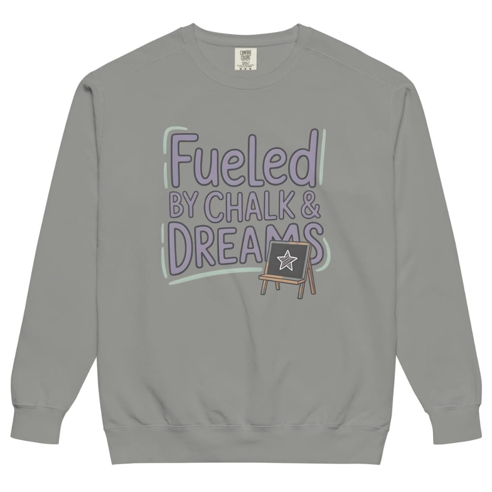 Fueled by Chalk & Dreams printed design on a vintage-style garment-dyed sweatshirt with chalkboard illustration – soft fleece ideal for teachers